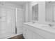 A bright white bathroom with double sinks and glass shower at 159 Morning View Way, Moncks Corner, SC 29461