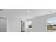 A bright bedroom with two windows that look out onto green space and a light and neutral carpet at 159 Morning View Way, Moncks Corner, SC 29461