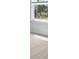 Bedroom with carpet, window, white walls, and an electrical outlet in this modern home at 159 Morning View Way, Moncks Corner, SC 29461