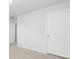 Carpeted bedroom with white trim, white walls, and white doors, ready for personalization at 159 Morning View Way, Moncks Corner, SC 29461