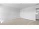 A bedroom with neutral carpet, white walls, and a door that leads to the hallway at 159 Morning View Way, Moncks Corner, SC 29461