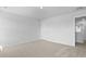 A bedroom with neutral carpet, white walls, and a door that leads to the hallway at 159 Morning View Way, Moncks Corner, SC 29461