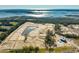 Aerial view of new waterfront community featuring various homes, a pond, and a pool at 1636 Siloh St # 478, Mount Pleasant, SC 29466