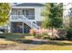 Backyard with deck, stairs, and lush landscaping at 1636 Siloh St # 478, Mount Pleasant, SC 29466
