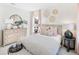 Serene bedroom with striped bedding, light wood dresser, and round mirror at 1636 Siloh St # 478, Mount Pleasant, SC 29466