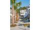 Houses with white stairs and palm trees along a sidewalk at 1636 Siloh St # 478, Mount Pleasant, SC 29466
