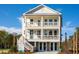 Two-story home with front porch, balconies, and double garage doors at 1636 Siloh St # 478, Mount Pleasant, SC 29466