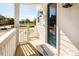 Front porch with a teal door and white railings, offering curb appeal at 1636 Siloh St # 478, Mount Pleasant, SC 29466