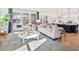 Open concept great room with white sofa and large windows at 1636 Siloh St # 478, Mount Pleasant, SC 29466