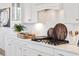 Modern white kitchen with stainless steel appliances and herringbone backsplash at 1636 Siloh St # 478, Mount Pleasant, SC 29466
