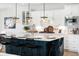 Modern kitchen island with white quartz countertops and dark blue cabinetry at 1636 Siloh St # 478, Mount Pleasant, SC 29466
