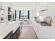 Open concept kitchen with island, white cabinets and breakfast nook at 1636 Siloh St # 478, Mount Pleasant, SC 29466