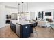 Open concept kitchen with island, stainless steel appliances, and hardwood floors at 1636 Siloh St # 478, Mount Pleasant, SC 29466