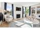 Cozy living room with fireplace, hardwood floors and large windows at 1636 Siloh St # 478, Mount Pleasant, SC 29466