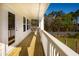 Spacious second floor deck with white railings and wooded views at 1636 Siloh St # 478, Mount Pleasant, SC 29466