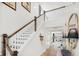 Elegant staircase with wooden railing and a view to living area at 1636 Siloh St # 478, Mount Pleasant, SC 29466