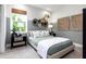 Bright bedroom with a queen-size bed and unique wall decor at 229 Claret Cup Way, Charleston, SC 29414