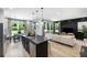 Open-concept kitchen with island, dining area, and living room views at 229 Claret Cup Way, Charleston, SC 29414