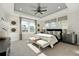 Luxurious main bedroom with high ceilings, large windows, and stylish furniture at 229 Claret Cup Way, Charleston, SC 29414