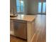 Modern kitchen island with stainless steel dishwasher and white cabinets at 144 Cantona Dr, Summerville, SC 29483