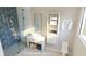 1st floor bathroom with herringbone tile shower and floating vanity at 35 W 9Th Street Ext, Folly Beach, SC 29439