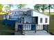 Modern two-story home with attached garage and elevated deck at 35 W 9Th Street Ext, Folly Beach, SC 29439