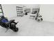 Spacious garage with gym equipment and room for vehicles at 35 W 9Th Street Ext, Folly Beach, SC 29439