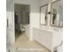 Primary bathroom with double vanity and a large walk-in shower at 35 W 9Th Street Ext, Folly Beach, SC 29439