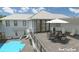 Spacious rooftop deck has a dining area, lounge chairs, and pool view at 35 W 9Th Street Ext, Folly Beach, SC 29439