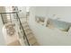 Modern staircase leading down to dining area and up to second floor at 35 W 9Th Street Ext, Folly Beach, SC 29439