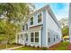 Side view of a light blue two-story house with white trim and landscaping at 135 Cantona Dr, Summerville, SC 29483