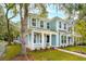 Two-story light blue house with white trim, porch, and landscaped yard at 135 Cantona Dr, Summerville, SC 29483