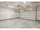 Unfinished garage with open garage door and concrete floor at 135 Cantona Dr, Summerville, SC 29483