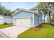 Attached garage with white door and blue siding at 135 Cantona Dr, Summerville, SC 29483