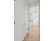 Clean hallway with white doors and hardwood floors leading to kitchen at 135 Cantona Dr, Summerville, SC 29483