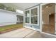 Screened porch with view of backyard and neighboring house at 135 Cantona Dr, Summerville, SC 29483