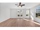 Bright Gathering room featuring hardwood floors and sliding glass doors to backyard at 412 Green Fern Drive, Summerville, SC 29483