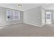 Spacious bedroom with neutral carpeting and door to hallway at 474 Green Fern Dr, Summerville, SC 29483