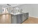 Modern kitchen island with stainless steel appliances and white countertops at 474 Green Fern Dr, Summerville, SC 29483