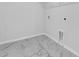 Laundry room with tile floor and built-in shelving at 474 Green Fern Dr, Summerville, SC 29483