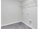 Laundry room with gray tile floor and wire shelving at 486 Green Fern Drive, Summerville, SC 29483