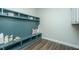 Built-in entryway bench with storage and upper shelving; adds charm and functionality at 305 Calm Breeze Aly, Summerville, SC 29486