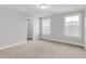 Spacious bedroom with neutral walls, carpet flooring, and ample closet space at 134 Cantona Dr, Summerville, SC 29483