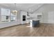 Modern kitchen with white cabinets, island, and hardwood floors at 134 Cantona Dr, Summerville, SC 29483