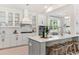 Spacious kitchen with an island, white cabinets, and stainless steel appliances at 134 Cantona Dr, Summerville, SC 29483