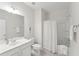 Clean bathroom with white vanity, tub shower, and neutral color palette at 418 Queenview Ln, Charleston, SC 29414