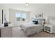 Bright bedroom with double bed, window and neutral decor at 418 Queenview Ln, Charleston, SC 29414