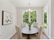 Bright dining area with round table and chairs, offering a view of the backyard at 418 Queenview Ln, Charleston, SC 29414