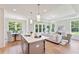 Modern kitchen with gray cabinets, island, and stainless steel appliances at 418 Queenview Ln, Charleston, SC 29414