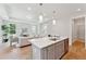 Kitchen island with white countertop, sink, and gray cabinets at 418 Queenview Ln, Charleston, SC 29414